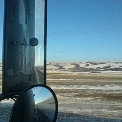 One of the advanced uses of CouchSurfing is catching a rideshare, like trucking through the Prairies pictured here.
