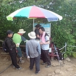 If the old man from that bus ride near Jeonju had seen this crowd of hikers gathered around a vendor's cart on a mountain peak, he wouldn't have worried about me hiking alone.