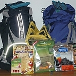 Our new backcountry gear: two backpacks, dehydrated meals, organizer bags, microfiber towels, mosquito net, camp-sized salt and pepper shakers...