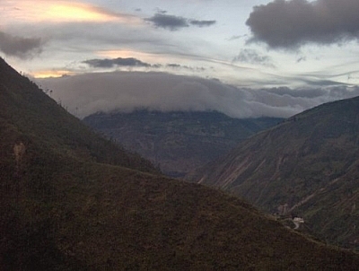 Clouds hugging a mountaintop, seen while hiking in Baños.