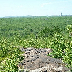 Sudbury visible in the distance from this rocky hilltop.