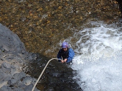 Canyoning down the second set of falls while repelling in Baños.