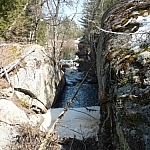 A stream cuts through a rock outcrop on its way to Lake Nipissing from Mashkinonje Park.