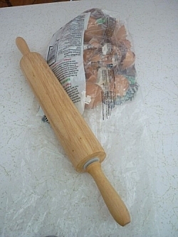 Rolling pin and bag of dried out egg shells ready to be crushed.