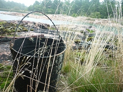 An old tar bucket left near Tar Vat Bay, in the area of Killarney's lighthouse.