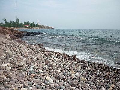 View of Killarney's lighthouse from a rocky beach on our return journey.