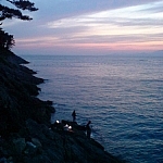 Observed people fishing at sunset one evening while exploring Yokji Island