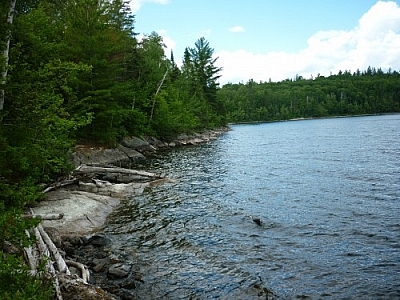 Hiking up Rib Mountain can start at this choppy stretch of the rocky, thickly forested Friday Lake shoreline.