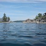 Gull Lake and forested islands, viewed from water level.