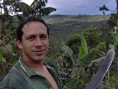 Close-up of the centre's only employee posing for the camera while hiking at Merazonia, with beautiful Amazonian and Andean scenery in the background.