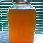 Cleaning green with a jar of kombucha vinegar.