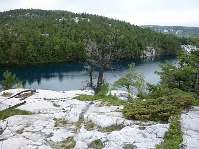 Stunningly beautiful blue lake waters seen while trekking Killarney's La Cloche Silhouette loop trail.