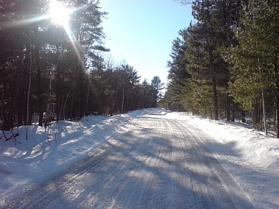 We've taken holiday tradition family walks down snowy Lafrenière Road (pictured) in Noëlville a few times...