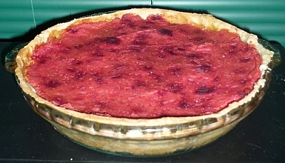 Mixed vegetable pie with a mashed potato and beet top crust.