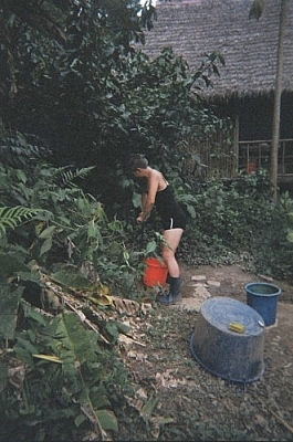 Volunteer tasks at Picaflor Research Centre include pumping well water into the holding tank.