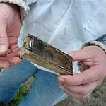 Tracy demonstrates a small wooden box.