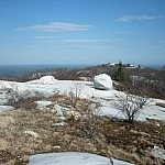 Distant view across Silver Peak, a white quartzite boulder in the middle.