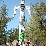 A totem pole erected on the shores of the French River at Dokis First Nation.