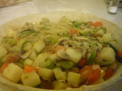 Vegetarian pie baking with mixed vegetables.