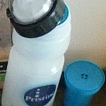 A cylindrical filter fits into the top of the wide-mouthed water bottle.