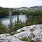 A beautiful lake surrounded by mountains, the typical scenery of trekking Killarney's La Cloche Silhouette loop trail.