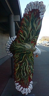 Tribal eagle sculpture colourfully painted.