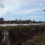 Sailboats on a river passing through Bundaberg in Queensland.