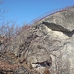 A more reassuring view of a staircase built on a steep, rocky hillside.