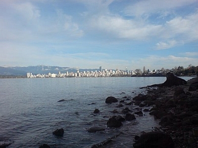 The Pacific Ocean and the downtown skyline with a mountainous backdrop, as seen while exploring Vancouver.